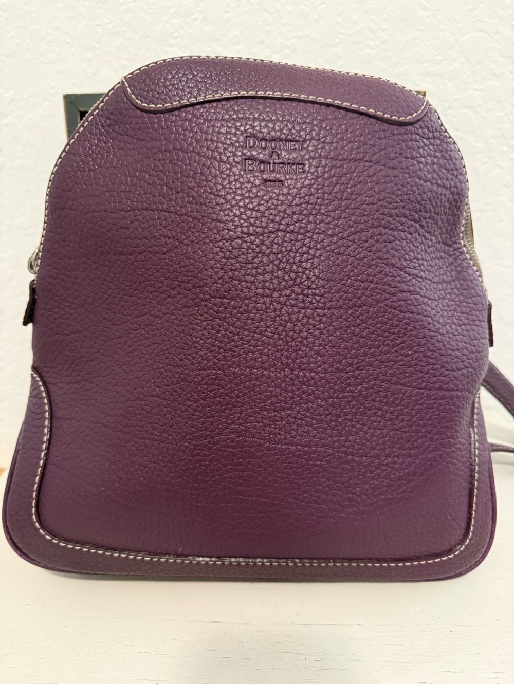Very nice Dooney and Bourke Plum pebbles grain zip pod back back NICE